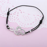CZ Studded Treble Clef on Contrasting Black Rope Bracelet